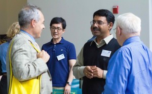Dr. Cabrera and Provost Stearns talk with Dr. Changwoo Ahn and Dr. Padmanabhan Seshaiyer.