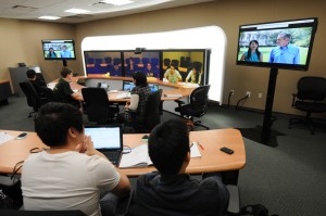 On the Mason Fairfax campus, Instructor Xi Chen teaches students across Virginia, including JMU and UVA students, Chinese for the Business World using TelePresence technology supported by the 4VA initiative.